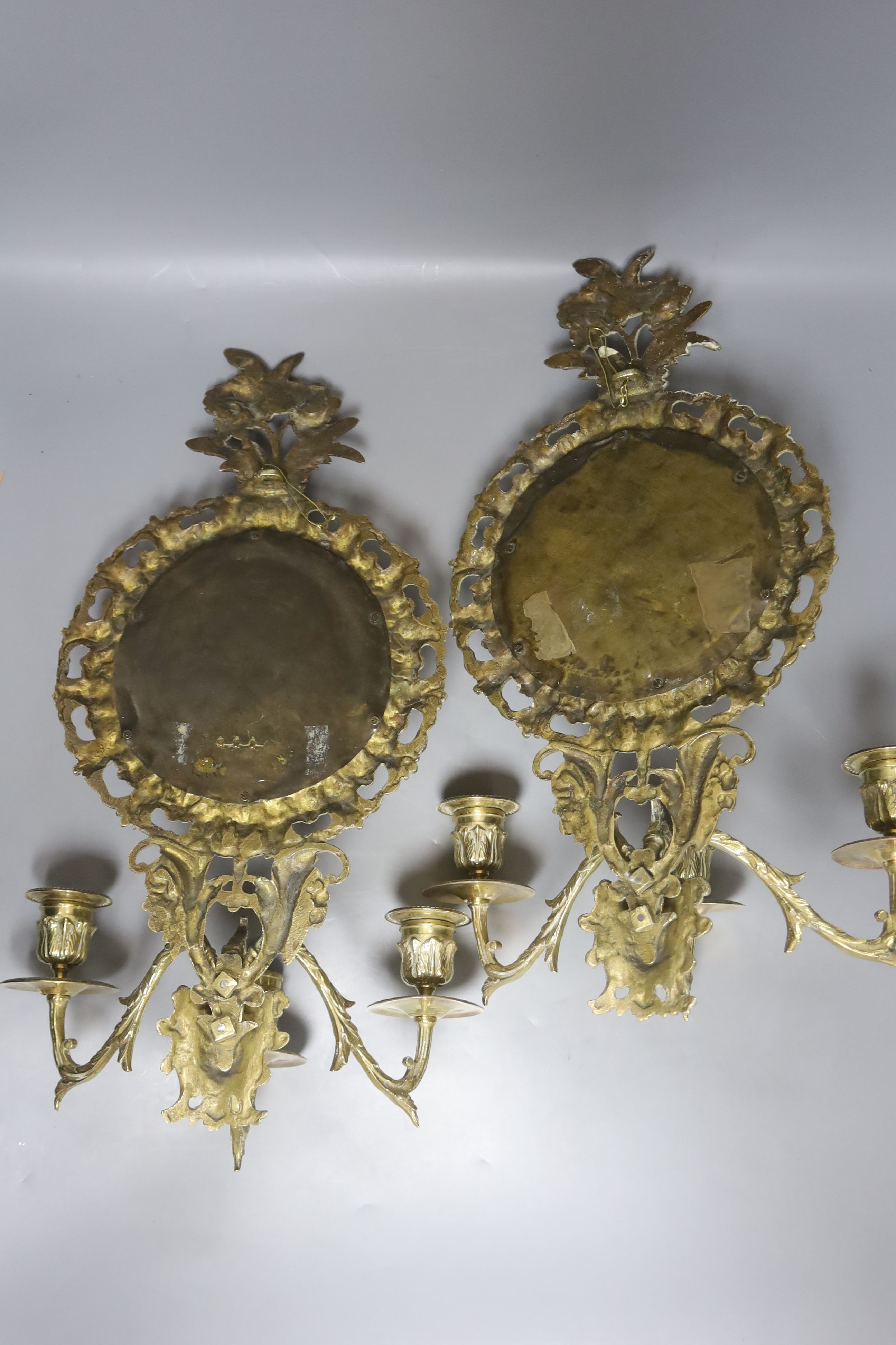 A pair of late 19th century French cast brass three sconce girandoles, height 42cm